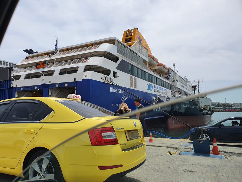 A ferry waiting at Piraeus to depart to Cyclades islands like Milos