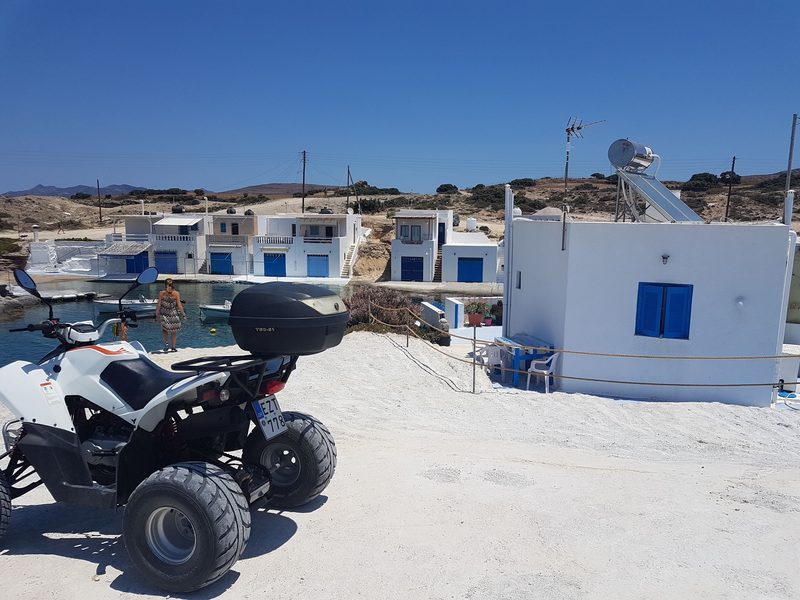 A quad bike by a fishing village in Milos