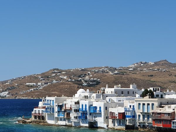 The Little Venice waterfront in Mykonos Town, with balconied houses standing at the edge of the sea