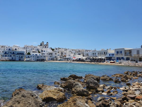 The whitewashed village of Naoussa on Paros seen across its small fishing harbour